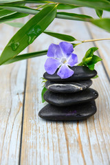 Black warmth zen stones decoration on old wooden background