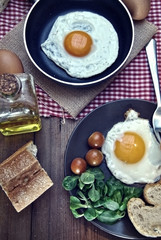 Fried eggs with bread and oil