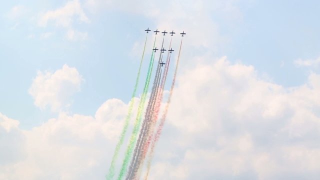 Spectators look at Nine CF-339 with colored smoke