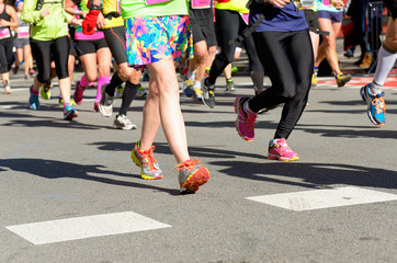 Marathon running race, people feet on road, woman run