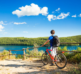Man with a Bike on Beautiful Nature Background - 80146046