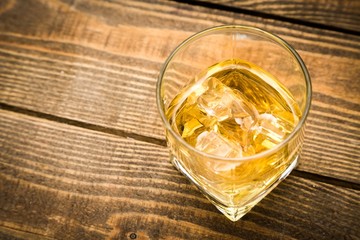 Whiskey. top view of whiskey in glass with ice