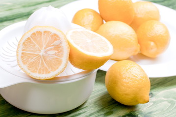 typical yellow sliced lemon on a green chalkboard