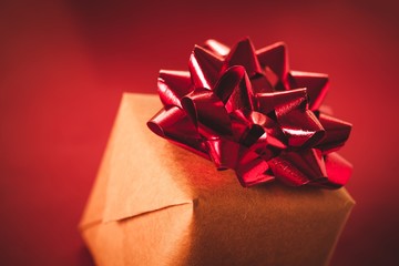 Gift. Elegantly wrapped present with a red ribbon.