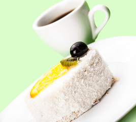 coconut piece of cake and coffee cup