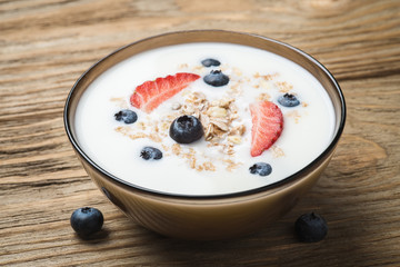 Muesli with yoghurt and fresh berries strawberry blueberry