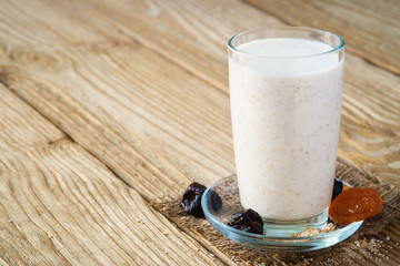 A cup of yogurt with wheat bran. Space for text