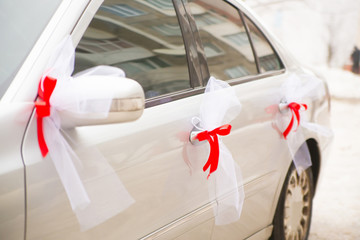 Luxury wedding car decorated with ribbons