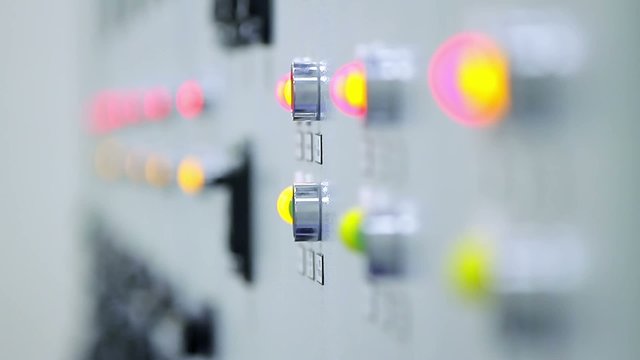 Control cabinets at an electrical substation stand in a row