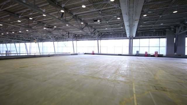 Big empty hall with big windows, moving camera
