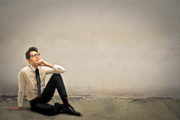 Businessman sitting on the ground