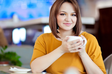Happy woman are relaxing in cafe