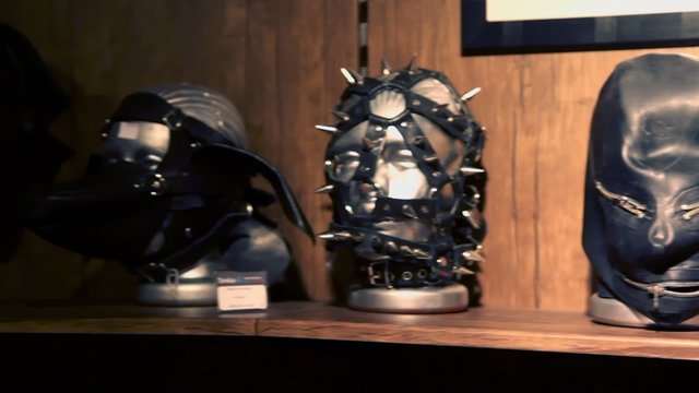 Several leaver masks on mannequins heads stand at showcase