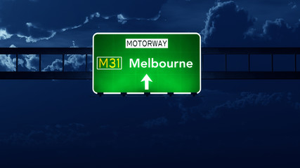 Naklejka premium Melbourne Australia Highway Road Sign at Night