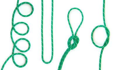 set of knots tied in green rope - isolated on white