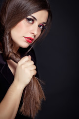 Beautiful woman with long brown straight hairs and red nails lyi