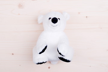 cute teddy bear toy on the board top view
