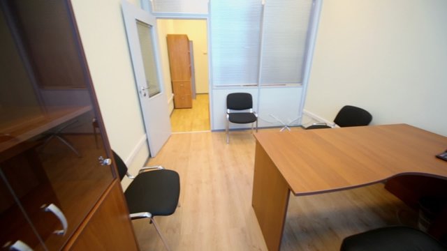 Interior of small empty office room with furniture