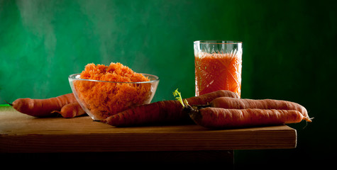 carrots lying on a wooden table