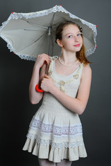12-13 years girl under an umbrella