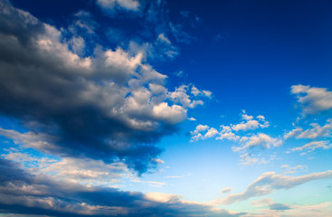 Blue sky with clouds and sun