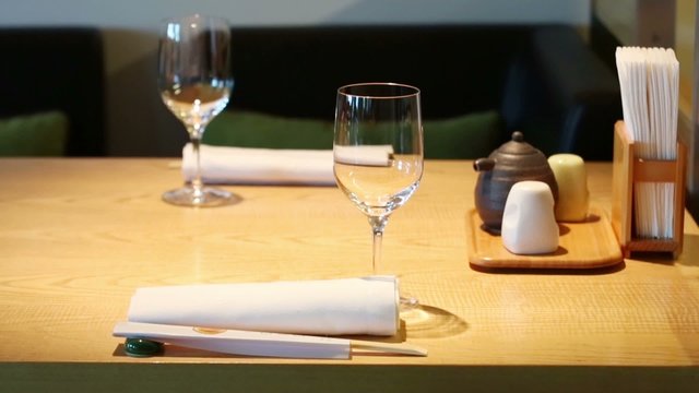 Table with glasses in cafe with modern cozy interior