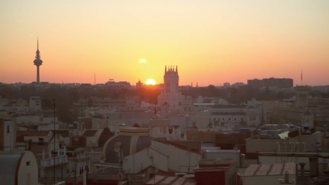 Cityscape with roofs of many houses and buildings at morning