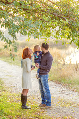 Fototapeta premium Young Attractive Parents and Child Portrait