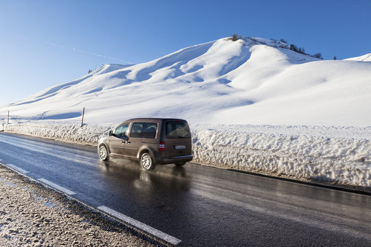 Winter moutain scenery, alpine road in Austrian, car speeding