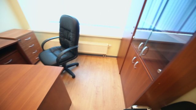 Interior of small empty cabinet with office furniture
