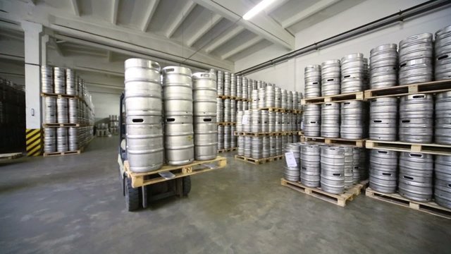 Autoloader with beer kegs drive in warehouse brewery