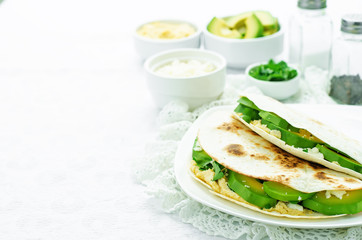 tortilla with hummus, avocado, feta and parsley