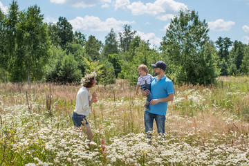 Young Attractive Parents and Child Portrait Outdoors