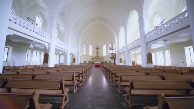 Rows of benches and Sanctuary in Evangelical Lutheran Cathedral