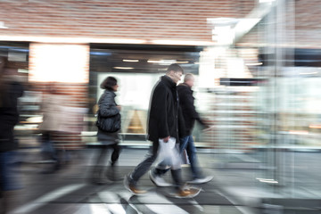 People rushing through corridor, zoom effect, motion blur