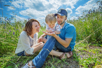 Young Attractive Parents and Child Portrait Outdoors