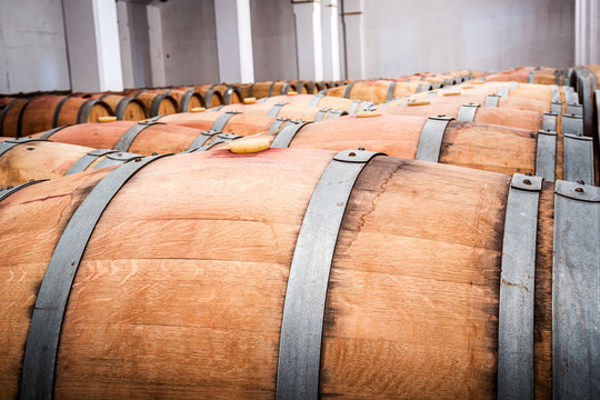 American Oak Barrels With Red Wine. Traditional Wine Cellar