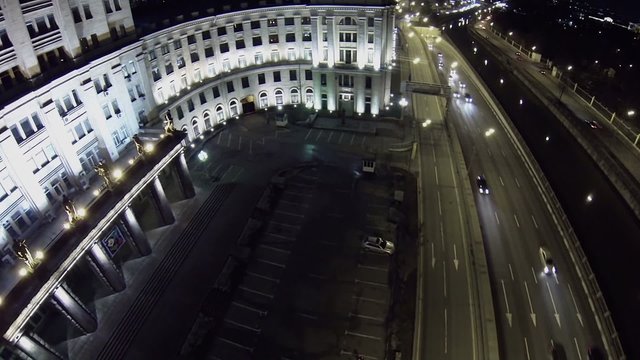 Traffic on quay of Yauza river near edifice of MGTU
