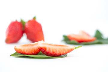 Fresh strawberry on green leaf show food concept