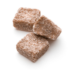 Brown lump cane sugar cube isolated on white background cutout