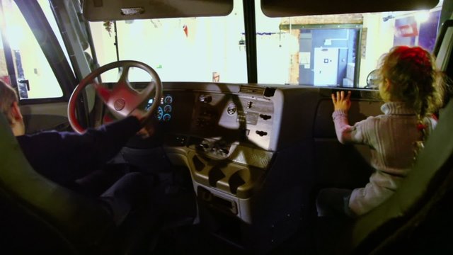 Boy Sit In Car On Driver Place With Sister At Passenger Chair