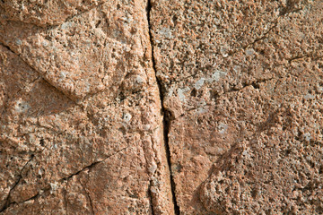 Cracked and porous red stone texture.
