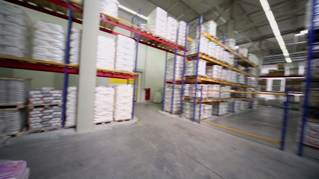 Warehouse with products on many shelves in Caparol factory