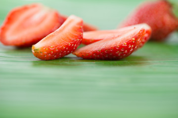 Fresh strawberries on banana leaf