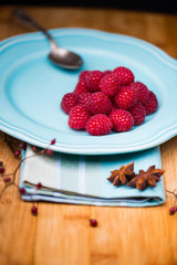 Raspberry on blue plate