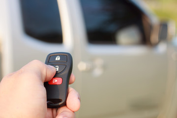 hand presses on the remote control car alarm systems