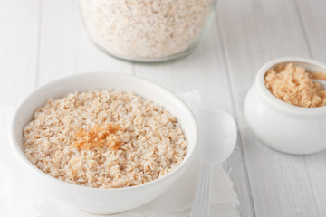 a bowl of cooked oatmeal with brown sugar
