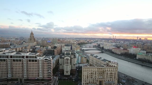 Railway station, government building abd river in evening city