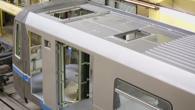 Wagon and mounted wheels under assemblage in workshop