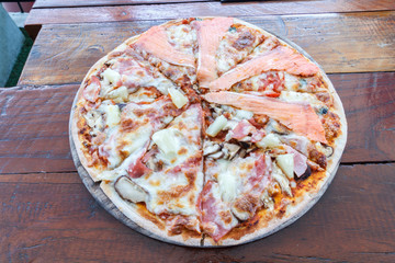 Pizza Hawaiian and Salmon pizza